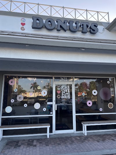 Peace Love and Little Donuts of Naples logo